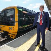 Councillor Tony Page, Mayor of Reading 2023-24, waves of the first train from Reading Green Park station.