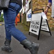 Voters arrive at a polling station. Credit: Mike Swift