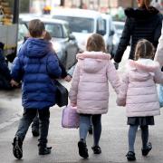Children walking to school. Councillors have raised concerns about dangerous parking outside schools in Reading.