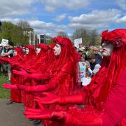 Members of the Red Rebel Brigade at the protest against raw sewage pollution into rivers at Victoria Park, Newbury on Sunday, April 14. Credit: John Sutton, Clearwater Photography