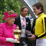 The Queen presents James Doyle with the Gold Cup after victory with Big Orange. All pictures: Sue Orpwood.