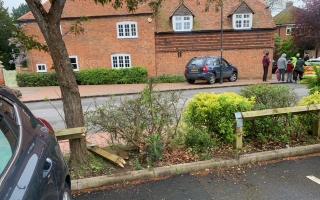 Three police cars and ambulance attend as woman REVERSES car through fence