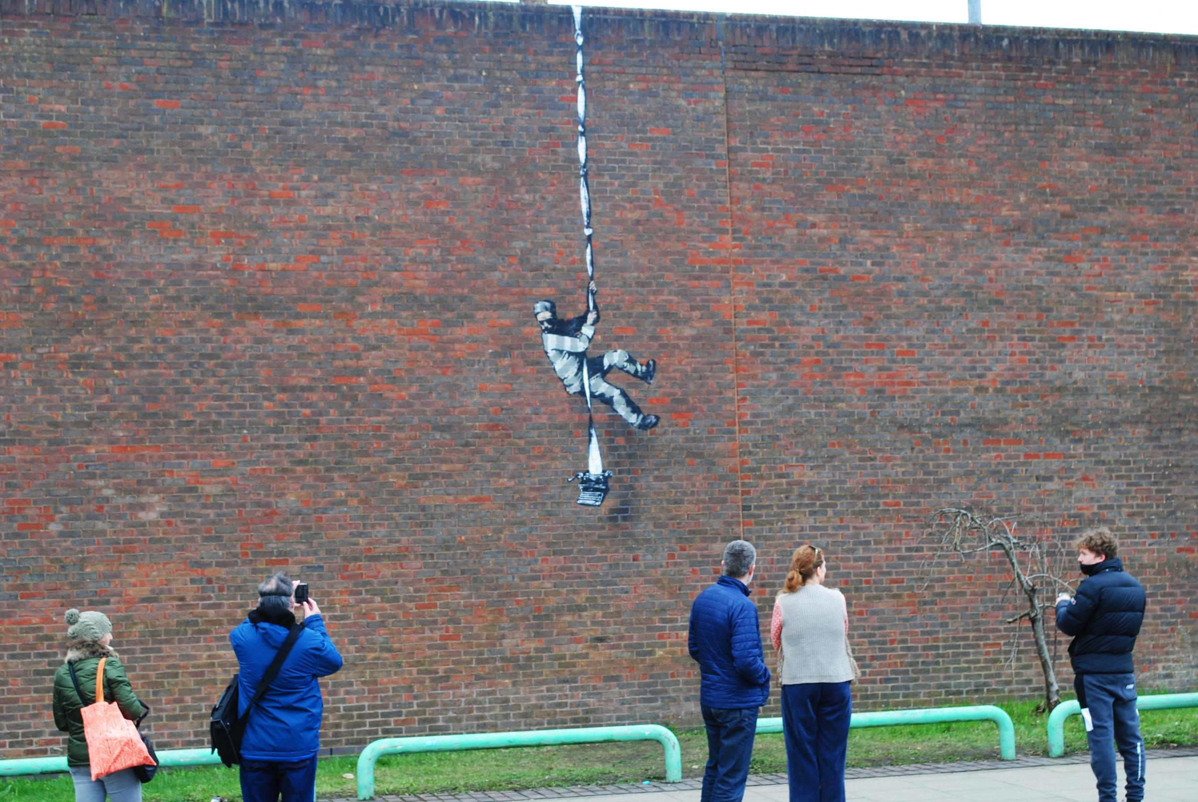 The Banksy mural on the wall of Reading Prison 