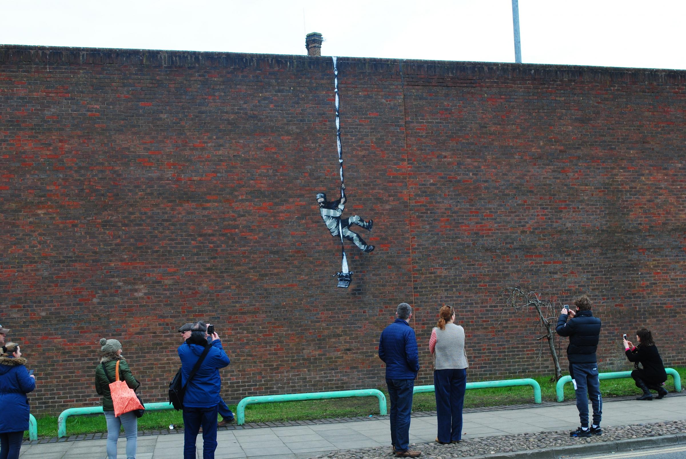 The Banksy mural on the wall of Reading Prison 