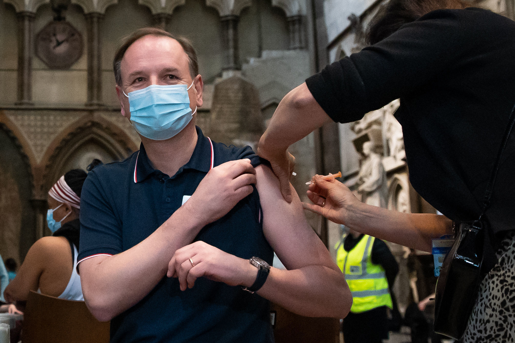 Dr Jan Maniera local GP and clinical director for south Westminster primary care network administers an injection of the Astra Zeneca coronavirus vaccine to Chief Executive of the National Health Service Sir Simon Stevens at Westminster Abbey, London.
