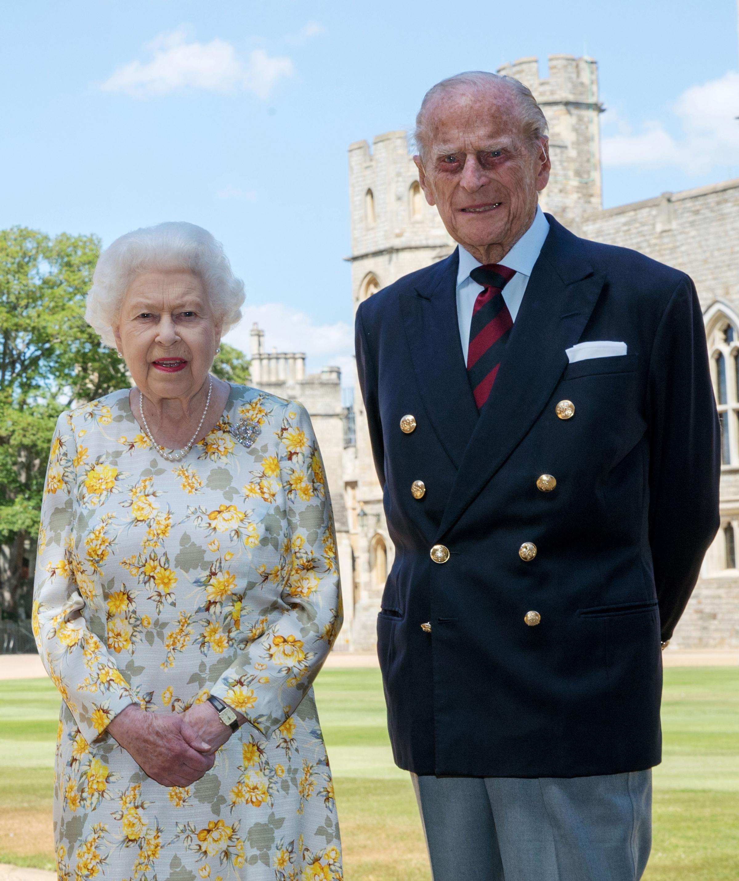 File photo dated 01/06/20 of Queen Elizabeth II and the Duke of Edinburgh in the quadrangle of Windsor Castle. The Queen is set to enter the milestone 70th year of her reign, as she prepares to mark the anniversary of her accession away from Sandringham