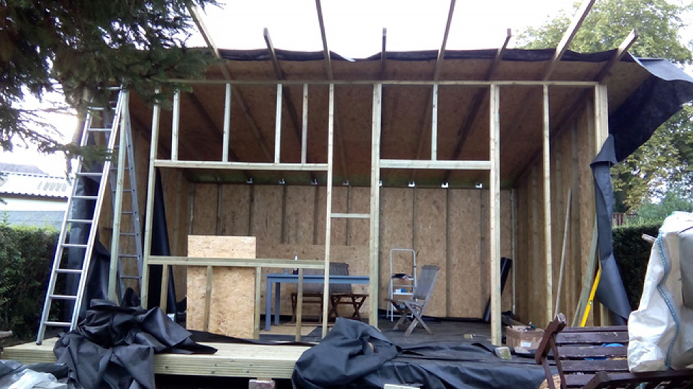 Photo of constructing the walls, windows and doors on a garden office project. Picture credit: PA Photo/Luke Spear