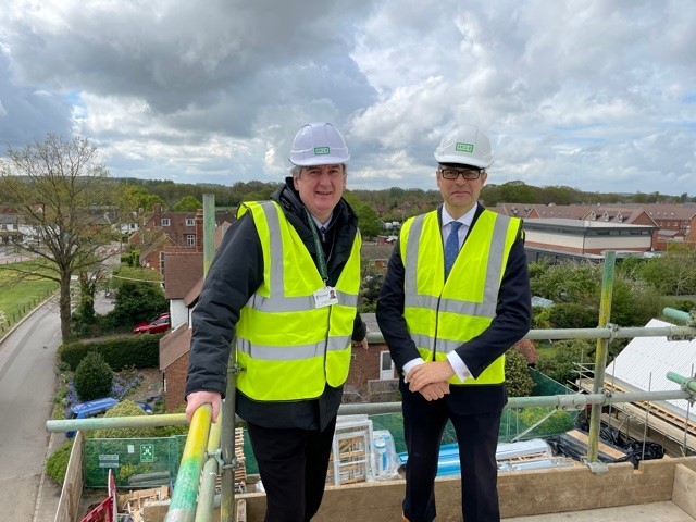 Andrew Grimes (left) with Ken Adams at the topping-out ceremony. Pic: Shinfield Parish Council