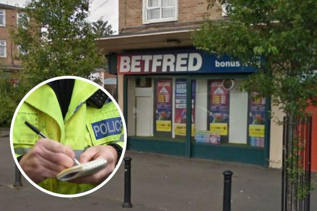 Masked man in pink gloves threatens betting shop staff 'at gunpoint'