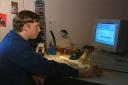 A Highdown School student uses his home computer in 1998 on the school's pioneering network, credit: BBC Archive