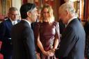 King Charles III speaks with, Prime Minister Rishi Sunak, Cop26 President Alok Sharma (left) and Stella McCartney, during a reception at Buckingham Palace, London, ahead of the Cop27 Summit. Credit:
 Jonathan Brady/PA Wire