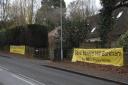 Banners calling for Edneys Hill in Barkham to be saved have been put up in the village. Credit:  Paul King
