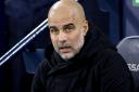 Pep Guardiola expects a tough challenge against Tottenham (Richard Sellers/PA)