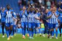 Simon Adingra and colleagues applaud the Albion fans after the game