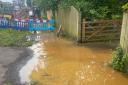 Sinkhole flooding causes traffic chaos in Bucks village