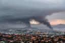 Smoke rises during protests in Noumea, New Caledonia (AP)