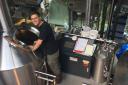 Jeff Hueneman brewing Zerodgrees' home-made alcohol