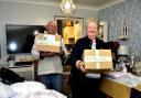 Ronnie Goodberry and Noreen Calnan photographed by Paul King at Ronnie's home in Woodley, surrounded by boxes of donations which left for Ukraine today.