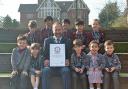 St Edward\'s Prep School has won the Guinness World Record for the biggest plastic bottle sentence. Pictured are pupils and Jonathan Parsons, the heateacher. Credit: St Edwards Prep & Nursery School