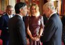 King Charles III speaks with, Prime Minister Rishi Sunak, Cop26 President Alok Sharma (left) and Stella McCartney, during a reception at Buckingham Palace, London, ahead of the Cop27 Summit. Credit:
 Jonathan Brady/PA Wire