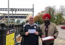 Mark Keeping and now former councillor Daya Pal Singh at Tilehurst station with a petition. Credit: Reading Labour