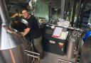 Jeff Hueneman brewing Zerodgrees' home-made alcohol
