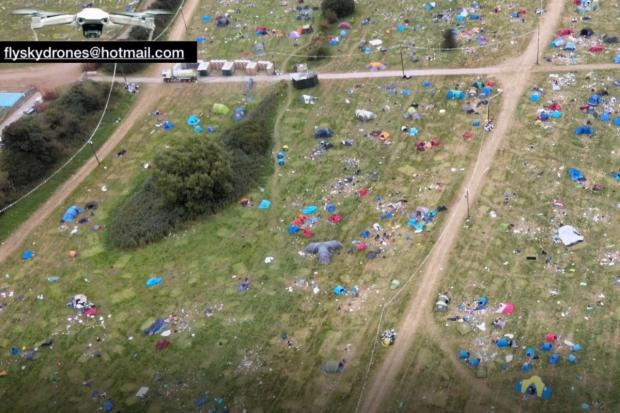 Reading Chronicle: The site of Reading Festival littered tents and rubbish that have been left behind by revellers at Little John's Farm, captured in footage shot by flyskydrones@hotmail.com 