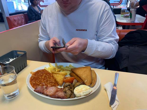 Reading Chronicle: My guest about to tuck in to his food