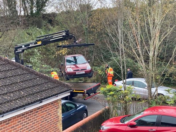 Reading Chronicle: Evidence of the cars being lifted so that the double yellow lines could be painted in Blackthorn Close, Earley. Credit: Don Barwick