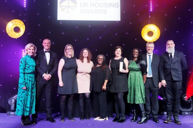 Reading councillor for housing Ellie Emberson and  members of the Housing team collect the Homebuilder of the Year award at the UK housing awards.