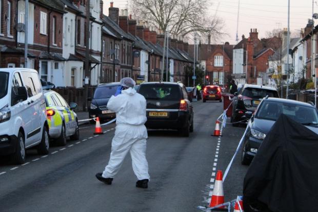 A police cordon in place at the scene of a murder investigation in Elgar Road, Reading on Thursday
