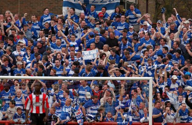Reading Chronicle: Reading fans celebrate Jamie Cureton's equaliser against Brentford. Image by: PA