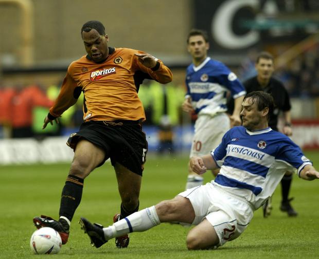 Reading Chronicle: Steve Brown goes in for a tackle against Wolves in the playoff semi-final. Image by: PA