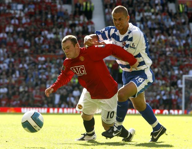 Reading Chronicle: Ivar Ingimarsson battles for the ball with Wayne Rooney in 2007. Image by: PA