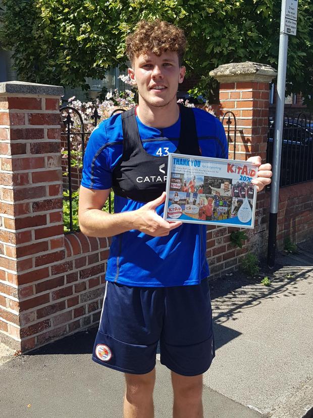 Reading Chronicle: Tom Holmes with his KitAid Thank You Certificate. Image by: KitAid