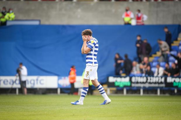 Reading Chronicle: Tom Holmes holds his head in his hands after QPR equalise late against Reading. Image by: JasonPIX
