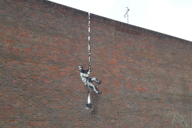 A new Banksy-esque artwork has appeared yards from Banksys own artwork on Reading Gaol