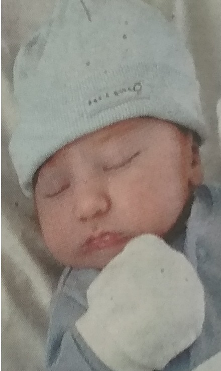 Baby Ed Martin enjoys a nap a few days after being born in 2012