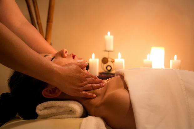 A woman being massaged. Credit: Canva