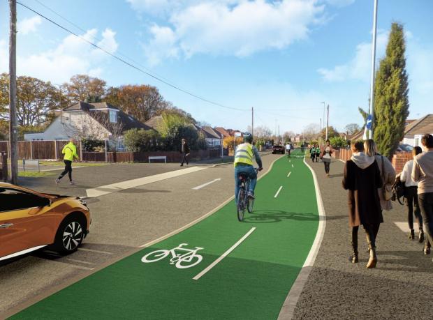 Reading Chronicle: A CGI of the proposed 'active travel route' between Woodley and Reading in Woodlands Avenue. Credit: Wokingham Borough Council