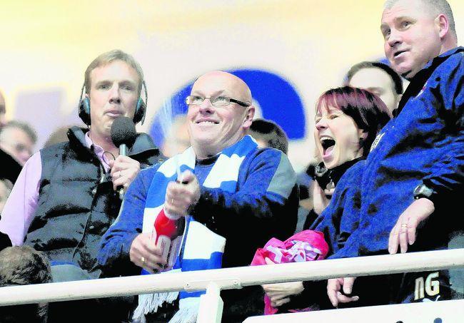 Super Brian with a bottle of bubbly (PA)