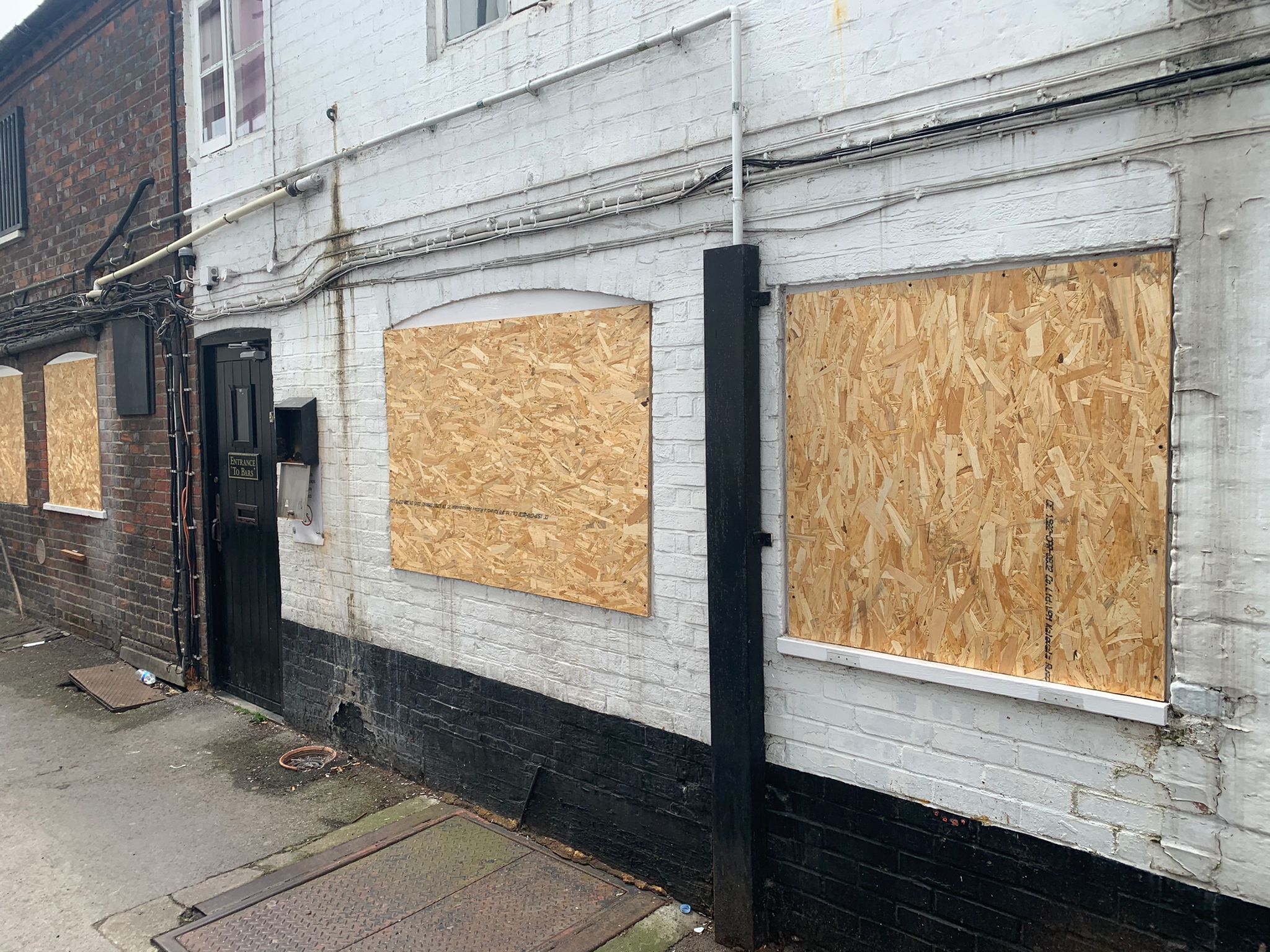 Boarded-up windows at The Bugle