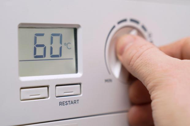 Person uses thermostat