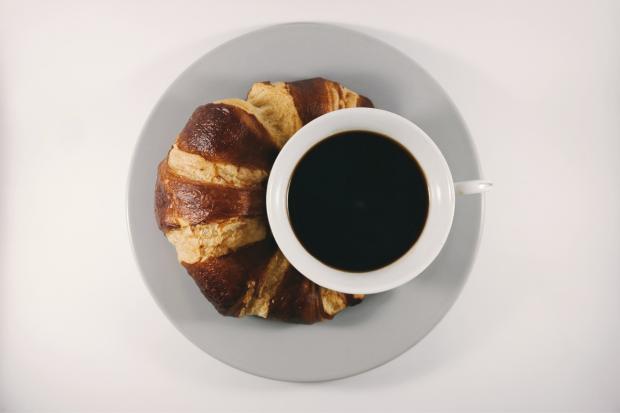Reading Chronicle: Coffee with a croissant. Credit: Canva