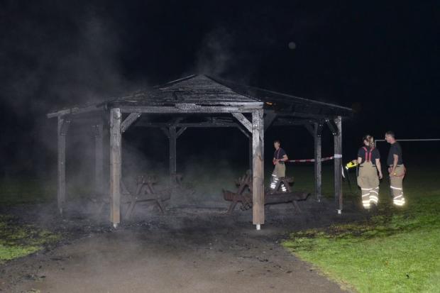 Firefighters cordoned Arborfield Park pavilion following a suspected arson attack yesterday (May 21) photographed by Paul King