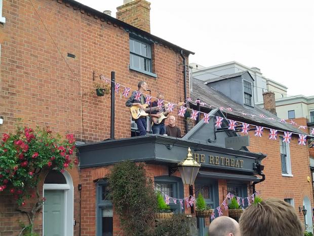 Reading Chronicle: A band plays in St John's Road on the roof of The Retreat
