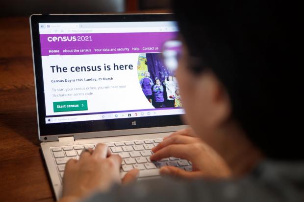 A woman logs on to the Census 2021 website ahead of all households being asked to complete the census ahead of Census Day on Sunday. Picture date: Saturday March 20, 2021..