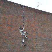 Artwork painted by Banksy on the wall of Reading Gaol