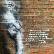 Art painted on the outer wall of Reading Gaol, for which Portus Abonae has claimed responsibility
