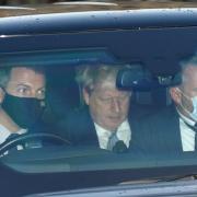 Prime Minister Boris Johnson (centre) leaves Houses of Parliament in Westminster, London, as public anger continues over 'partygate'
